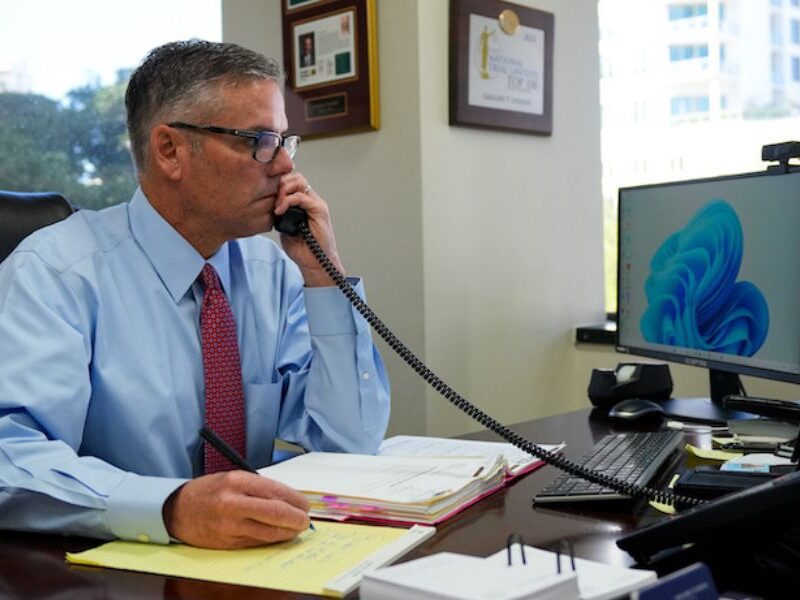 Greg Linehan on the phone at his desk