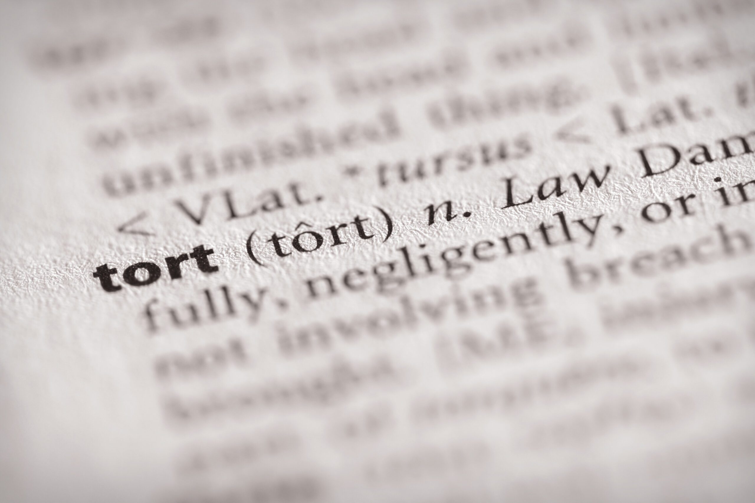 Close up of the definition of the word tort