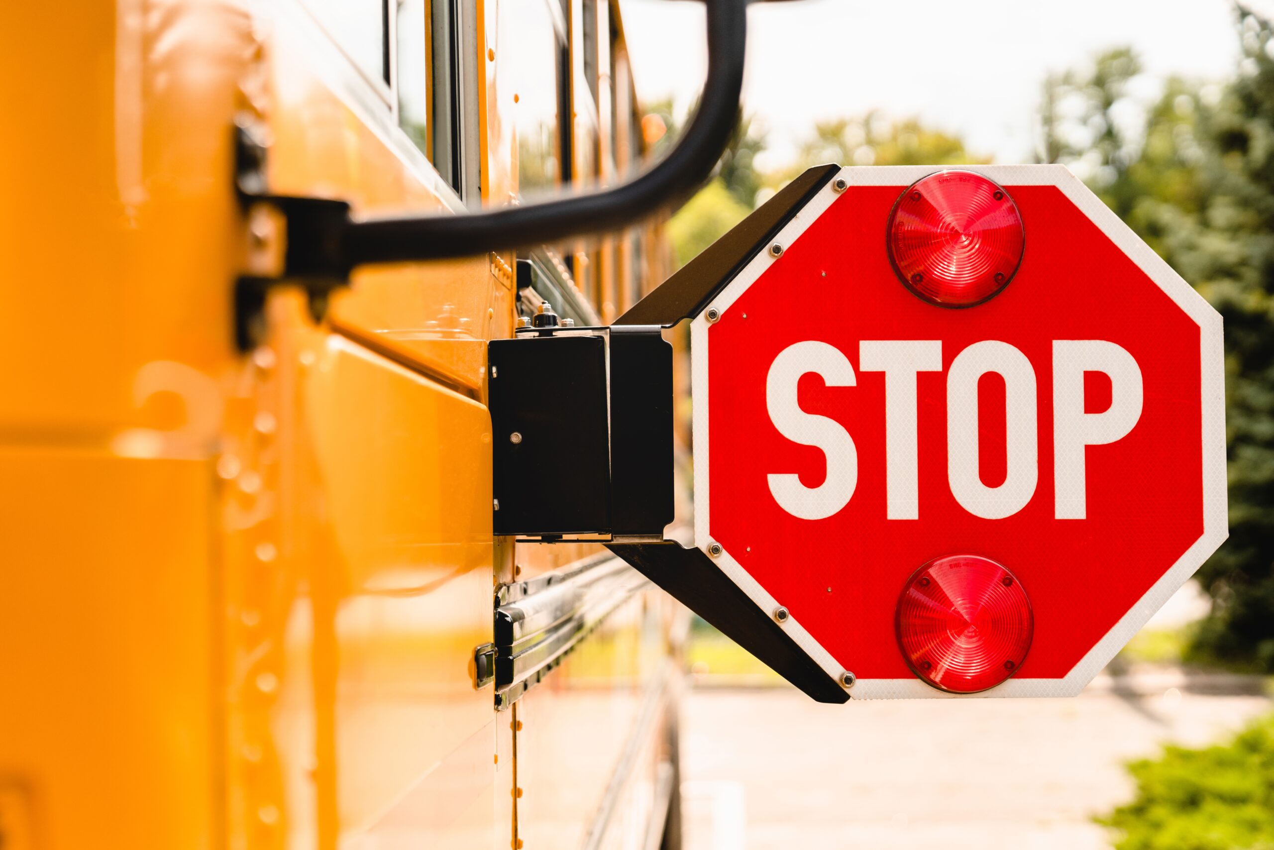 A school bus stop sign